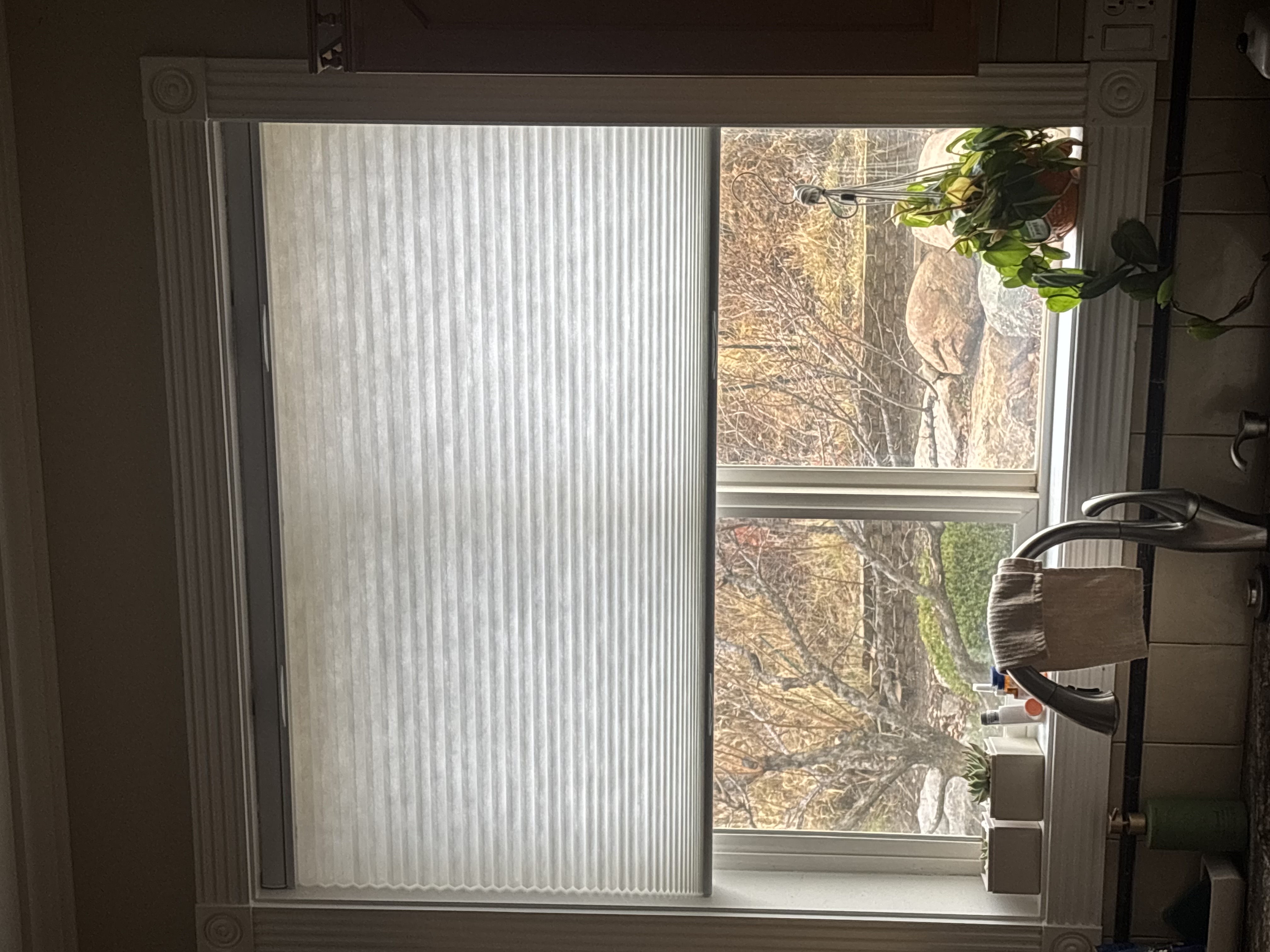 Cellular shade in kitchen window